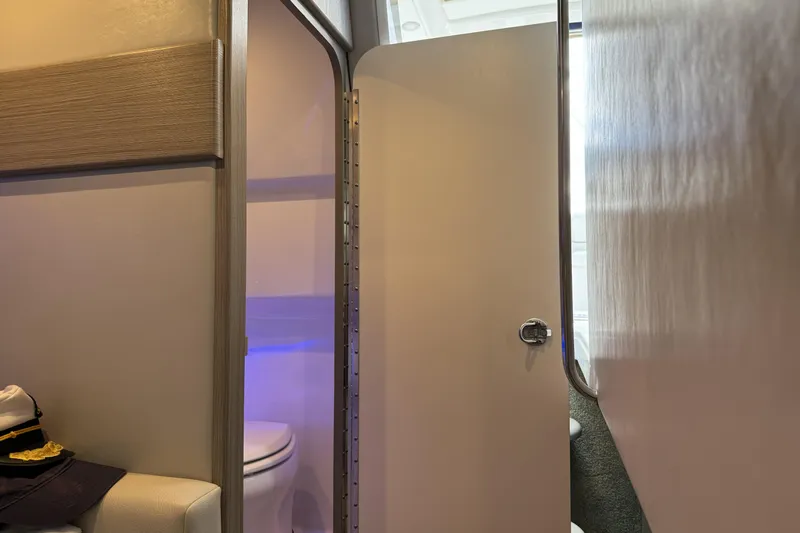  Yacht Photos Pics Interior view of 2021 Formula 330 Crossover Bowrider OB, featuring a compact bathroom.