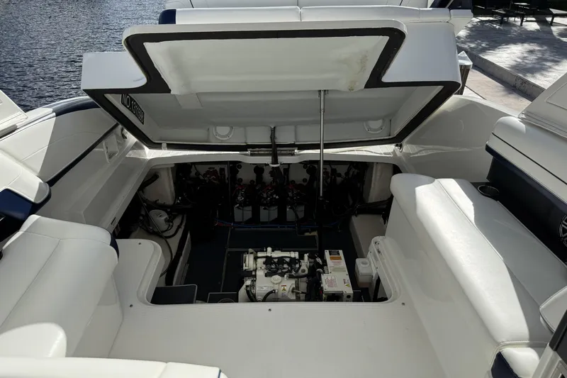  Yacht Photos Pics 2021 Formula 330 Crossover Bowrider OB engine compartment, open hatch, dockside view.
