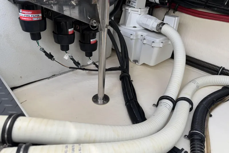  Yacht Photos Pics Engine compartment of 2021 Formula 330 Crossover Bowrider OB with fuel filters and hoses.