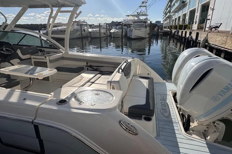  Yacht Photos Pics 2021 Robalo R317 Dual Console boat docked, featuring spacious seating and twin Yamaha engines.