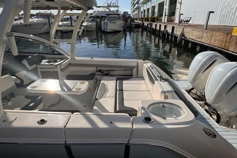  Yacht Photos Pics 2021 Robalo R317 Dual Console boat docked, featuring spacious seating and twin engines.