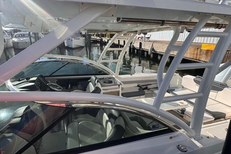  Yacht Photos Pics 2021 Robalo R317 Dual Console boat interior at marina, showcasing seating and helm.