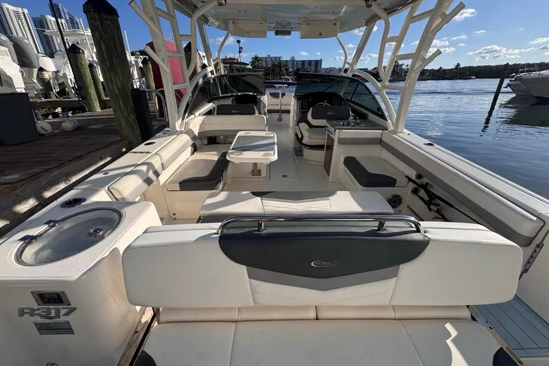  Yacht Photos Pics 2021 Robalo R317 Dual Console boat interior with seating and water view.