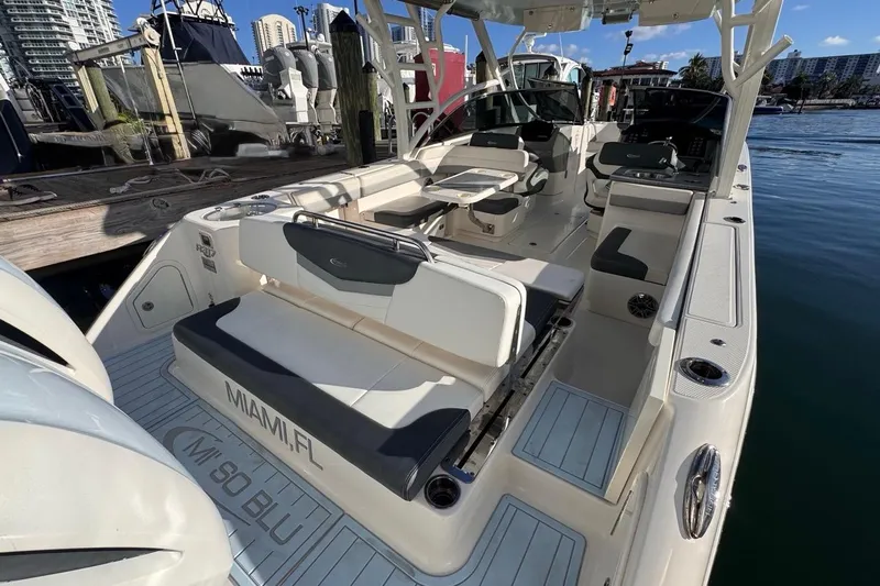  Yacht Photos Pics 2021 Robalo R317 Dual Console boat docked in Miami, featuring spacious seating and modern design.