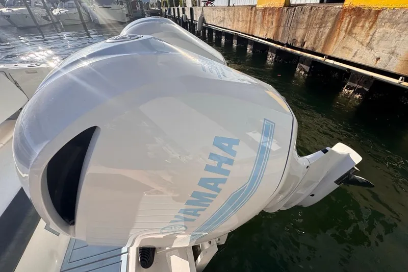  Yacht Photos Pics 2021 Robalo R317 Dual Console with Yamaha outboard engine at dockside.