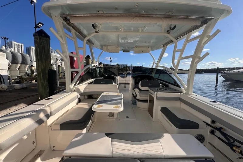  Yacht Photos Pics 2021 Robalo R317 Dual Console boat interior, docked with seating and helm view.