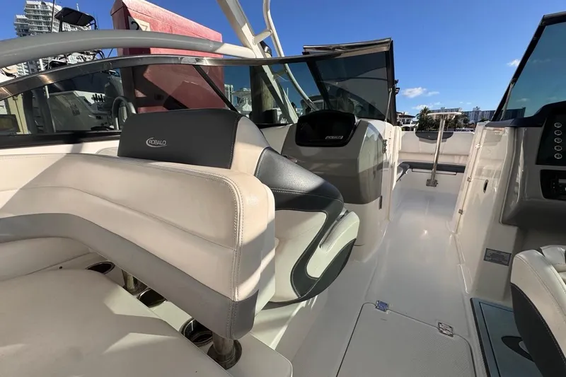  Yacht Photos Pics 2021 Robalo R317 Dual Console boat interior with modern seating and dashboard.
