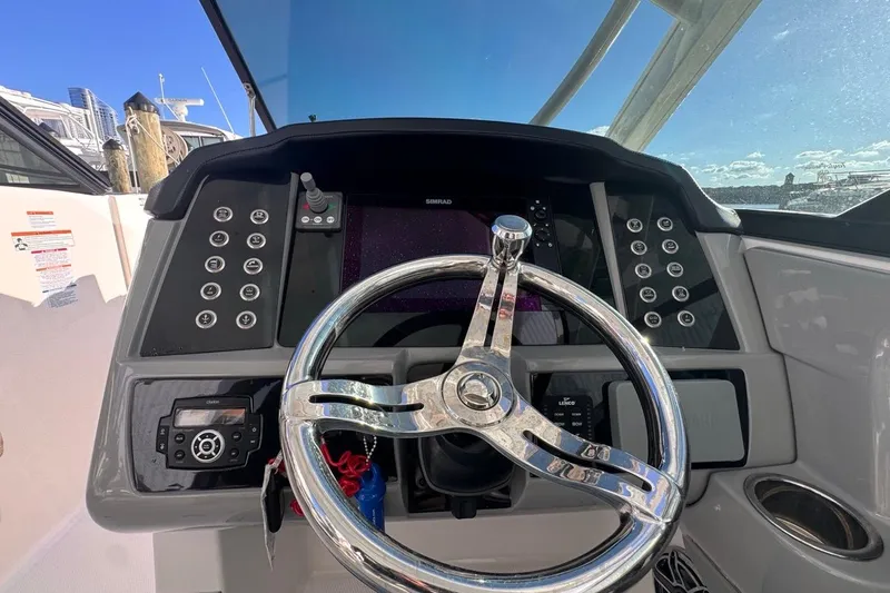  Yacht Photos Pics 2021 Robalo R317 Dual Console helm with modern controls and steering wheel.