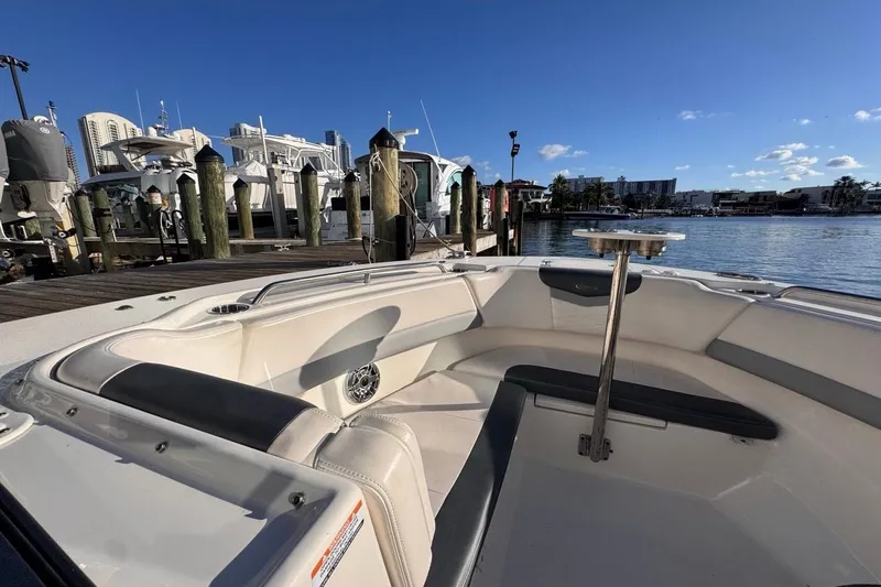  Yacht Photos Pics 2021 Robalo R317 Dual Console boat docked at marina under clear blue sky.