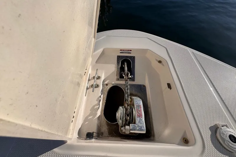  Yacht Photos Pics 2021 Robalo R317 Dual Console anchor compartment with chain and winch.