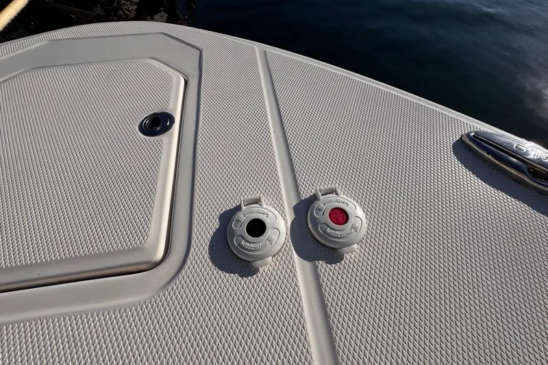  Yacht Photos Pics 2021 Robalo R317 Dual Console boat deck with hatch and fuel caps.