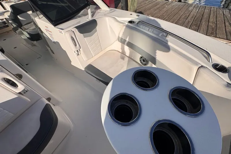  Yacht Photos Pics 2021 Robalo R317 Dual Console boat interior with seating and cup holders.