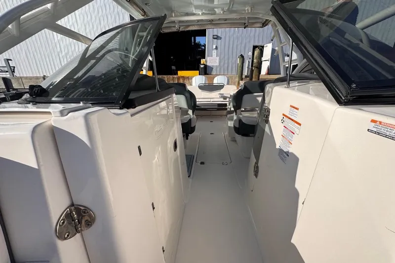  Yacht Photos Pics 2021 Robalo R317 Dual Console boat interior with open cockpit and seating.