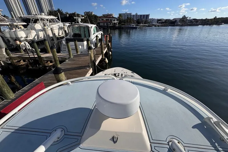  Yacht Photos Pics 2021 Robalo R317 Dual Console docked at marina, calm water, clear sky.