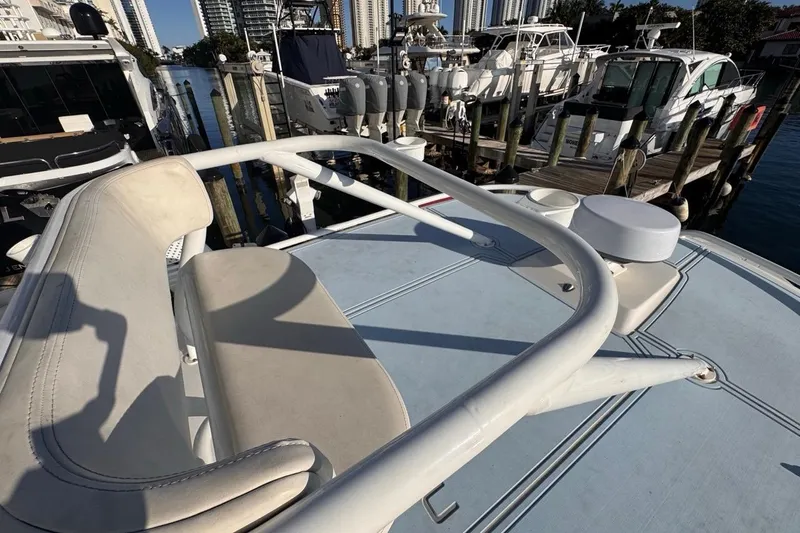  Yacht Photos Pics 2021 Robalo R317 Dual Console boat docked at marina with cityscape background.