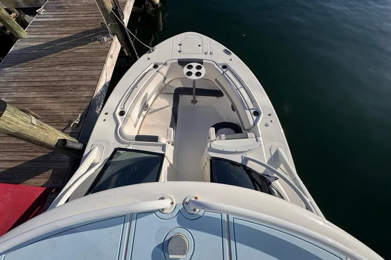  Yacht Photos Pics 2021 Robalo R317 Dual Console boat docked, top view of bow seating area.