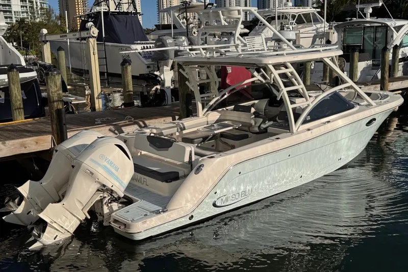  Yacht Photos Pics 2021 Robalo R317 Dual Console boat docked with Yamaha outboard engines.