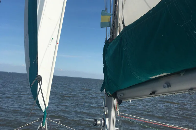 Wayward Sun Yacht Photos Pics Sailing on a 2000 Lagoon 380 catamaran with blue sails and clear skies.