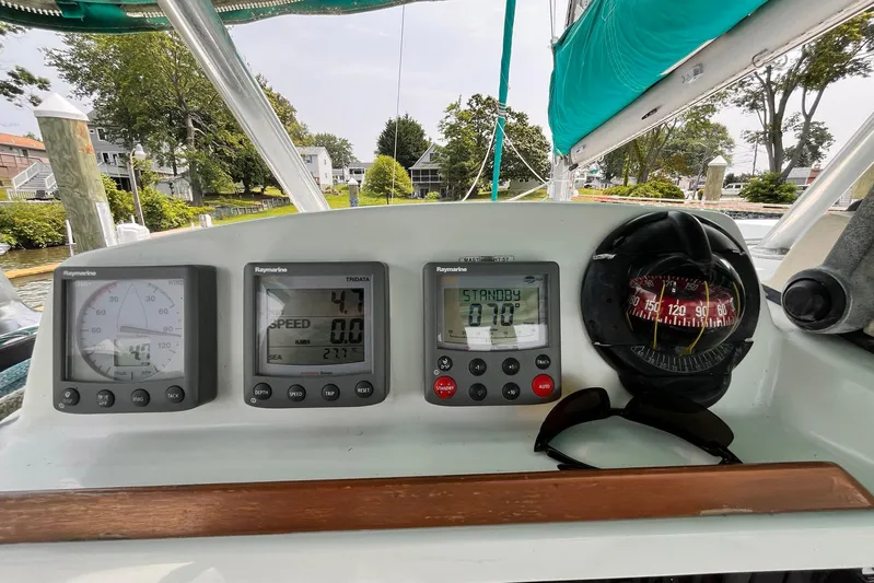 Wayward Sun Yacht Photos Pics Lagoon 380 yacht cockpit with navigation instruments and compass, showcasing speed and direction.