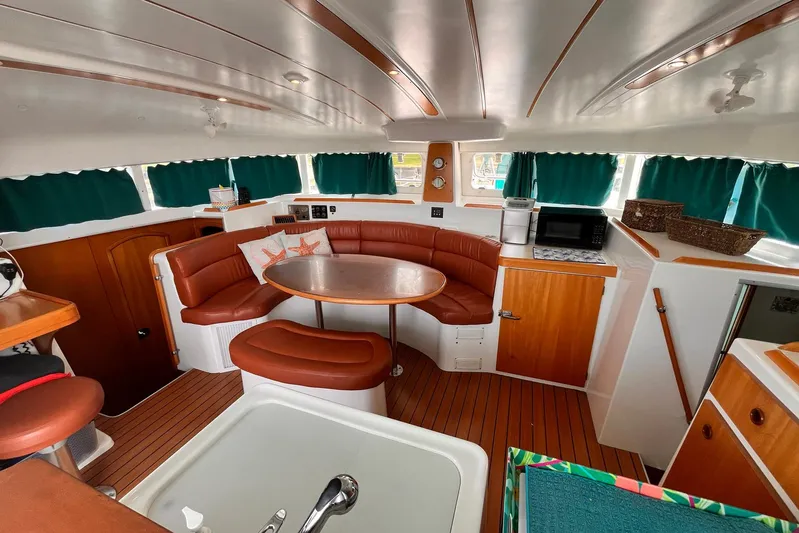 Wayward Sun Yacht Photos Pics Interior of 2000 Lagoon 380 catamaran with cozy seating and modern amenities.