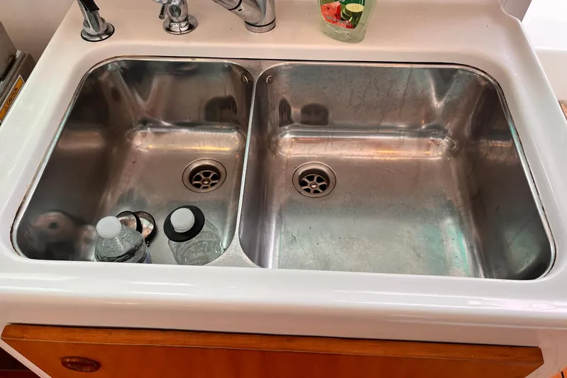 Wayward Sun Yacht Photos Pics Stainless steel double sink with bottles, Lagoon 380, 2000 model.