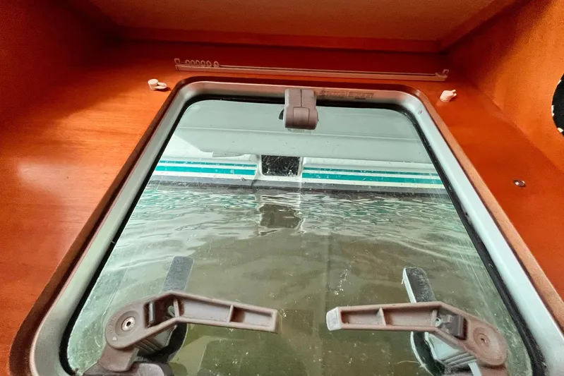 Wayward Sun Yacht Photos Pics Cabin window view from a 2000 Lagoon 380 catamaran, partially submerged.