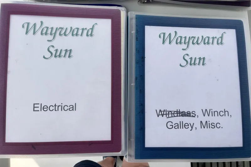 Wayward Sun Yacht Photos Pics Binders labeled "Wayward Sun" for electrical and miscellaneous boat components. Lagoon 380, 2000 model.