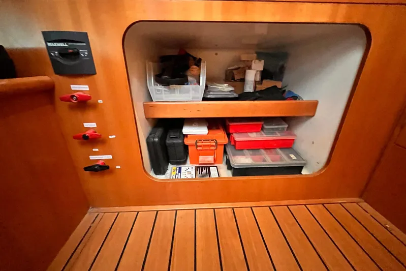 Wayward Sun Yacht Photos Pics Storage compartment on a 2000 Lagoon 380 catamaran with organized tools and equipment.