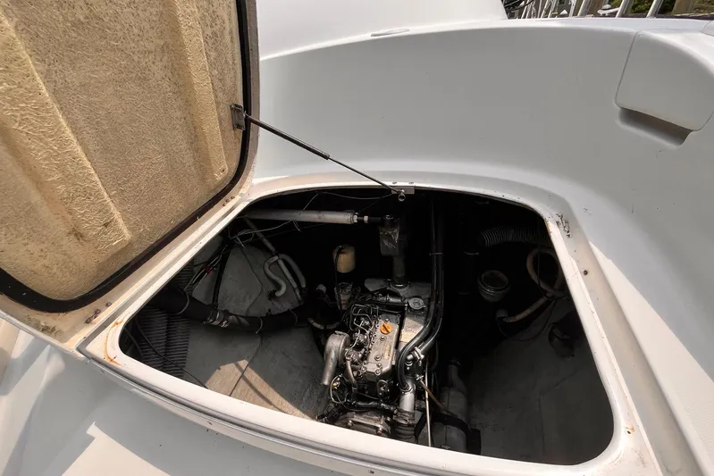 Wayward Sun Yacht Photos Pics Open engine compartment of a 2000 Lagoon 380 catamaran, showcasing internal components.