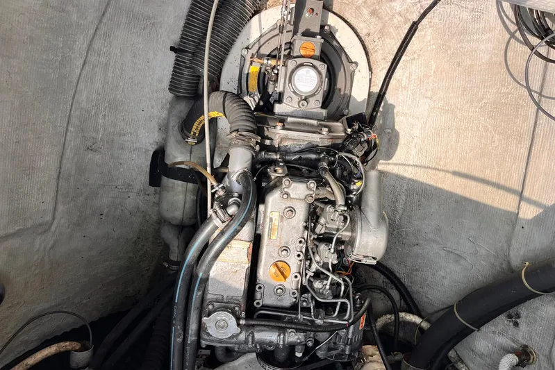 Wayward Sun Yacht Photos Pics Engine compartment of a 2000 Lagoon 380 catamaran, showcasing detailed mechanical components.