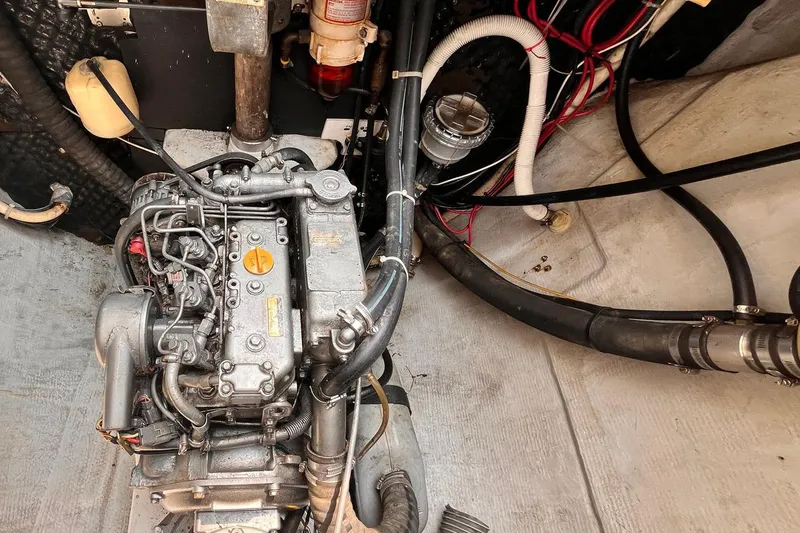 Wayward Sun Yacht Photos Pics Engine compartment of a 2000 Lagoon 380 catamaran, showing detailed mechanical components.