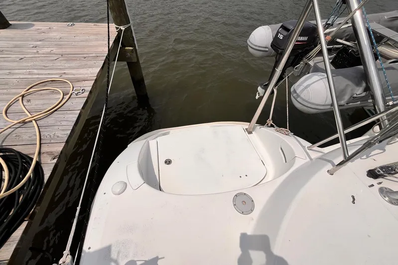 Wayward Sun Yacht Photos Pics Lagoon 380 catamaran docked, showing stern and Yamaha outboard motor, 2000 model.