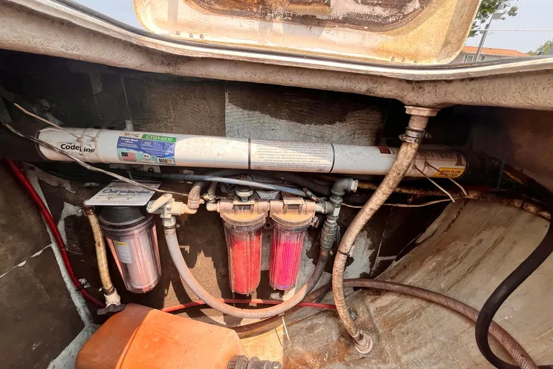 Wayward Sun Yacht Photos Pics Water filtration system in a 2000 Lagoon 380 catamaran engine compartment.