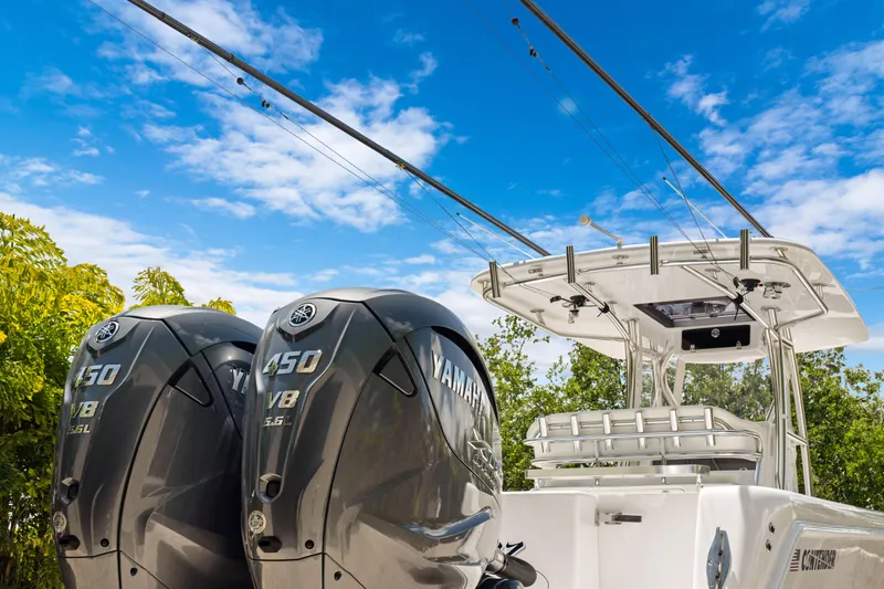  Yacht Photos Pics 2024 Contender 35 ST boat with dual Yamaha 450 engines under a clear blue sky.