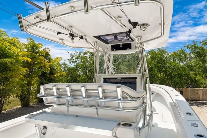  Yacht Photos Pics 2024 Contender 35 ST boat with sleek design and advanced features, set against a lush backdrop.