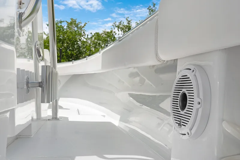  Yacht Photos Pics 2024 Contender 35 ST boat interior with speaker, sleek white design, and clear blue sky.