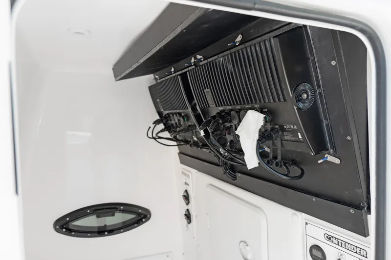  Yacht Photos Pics 2024 Contender 35 ST boat interior with electronic equipment and wiring.