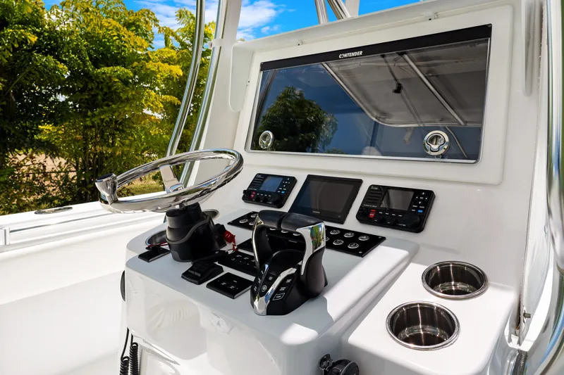  Yacht Photos Pics 2024 Contender 35 ST boat helm with modern controls and navigation systems.