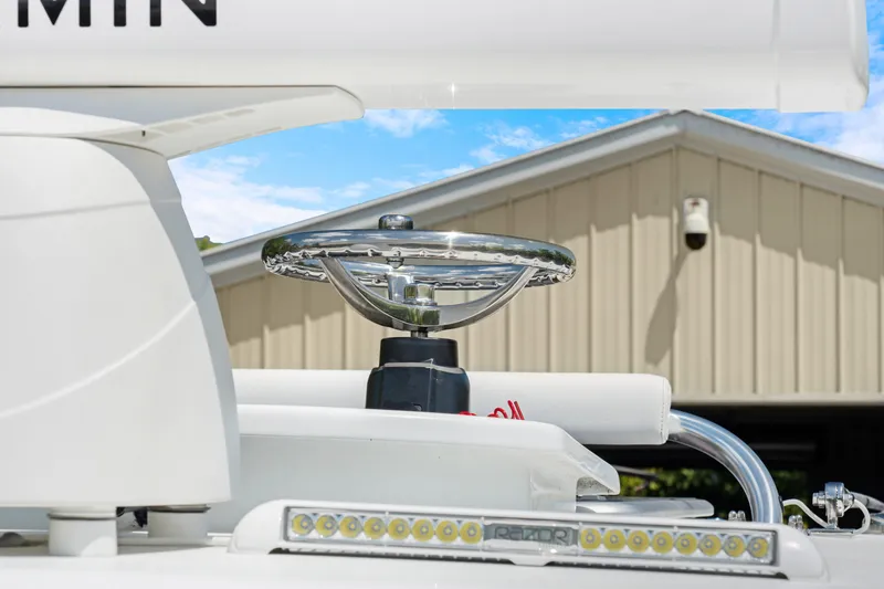 Yacht Photos Pics 2024 Contender 35 ST boat helm with modern steering wheel and LED lights.