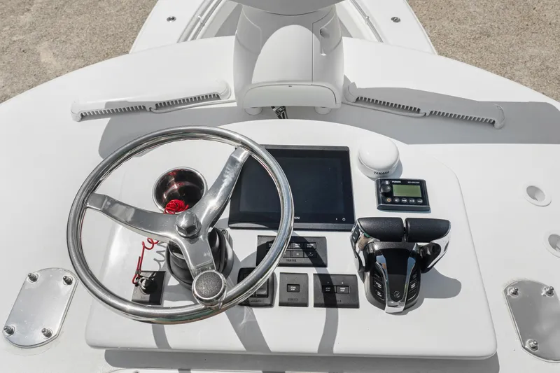  Yacht Photos Pics 2024 Contender 35 ST boat helm with steering wheel and controls.