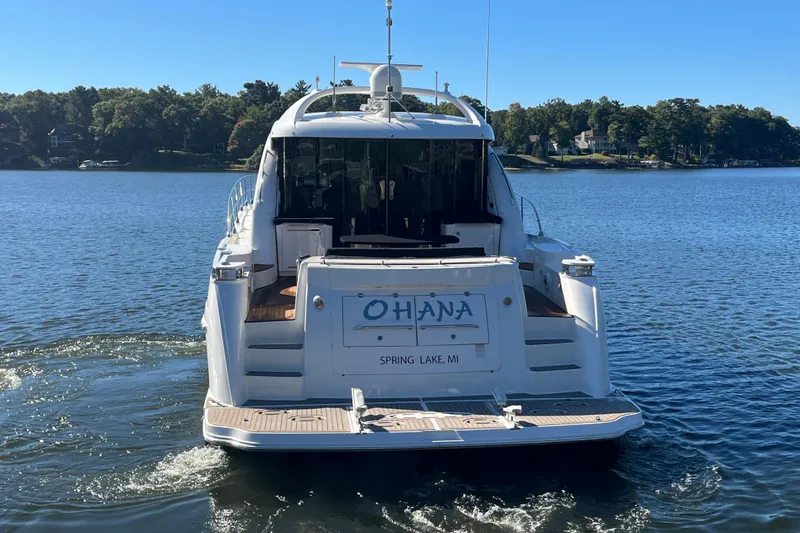 Ohana Yacht Photos Pics 2007 Sea Ray 60 Sundancer yacht on a serene lake, rear view.