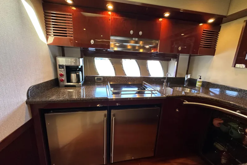 Ohana Yacht Photos Pics Luxurious kitchen interior of 2007 Sea Ray 60 Sundancer yacht with modern appliances.