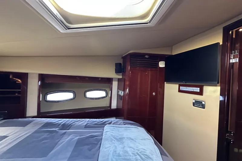 Ohana Yacht Photos Pics Luxurious cabin interior of 2007 Sea Ray 60 Sundancer yacht with skylight and TV.