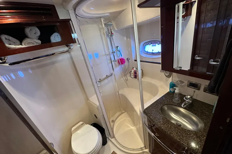 Ohana Yacht Photos Pics Luxurious bathroom in 2007 Sea Ray 60 Sundancer yacht with shower and sink.