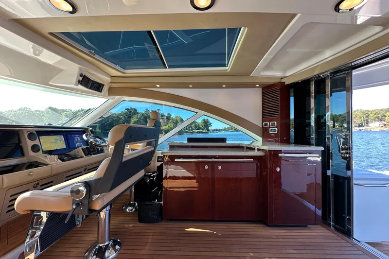 Ohana Yacht Photos Pics Luxurious 2007 Sea Ray 60 Sundancer yacht interior with modern helm and panoramic windows.