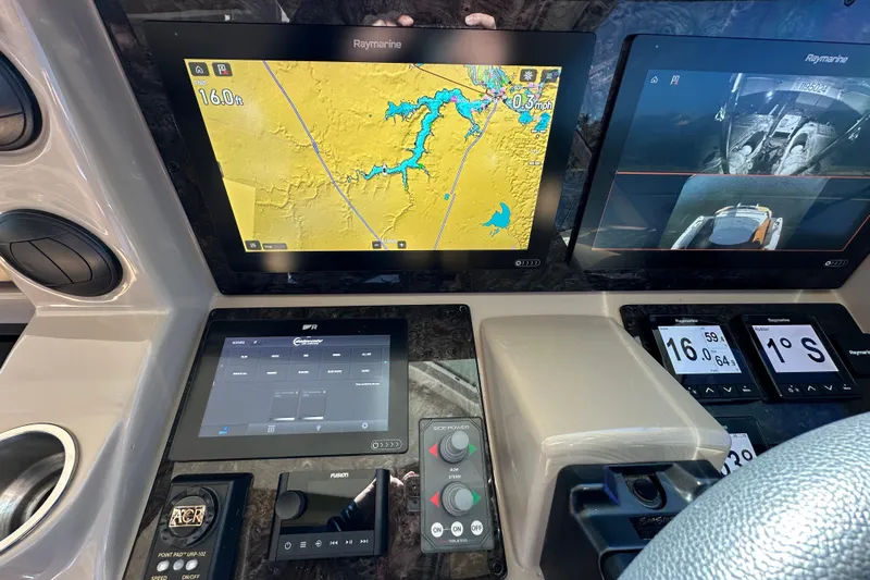 Ohana Yacht Photos Pics Control panel of a 2007 Sea Ray 60 Sundancer with navigation and monitoring screens.