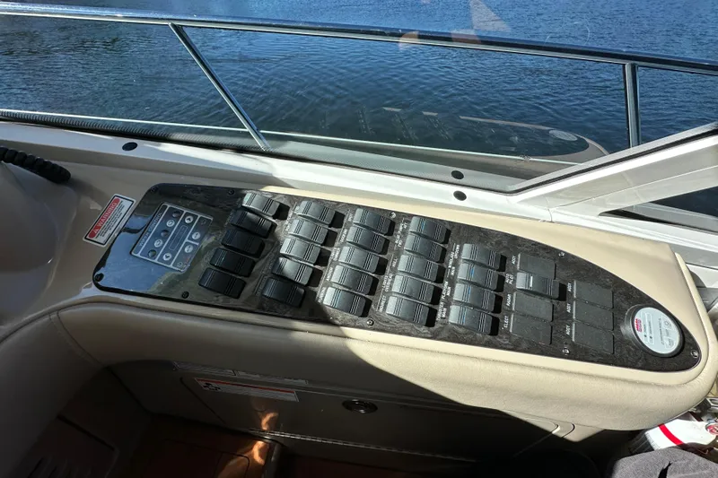 Ohana Yacht Photos Pics Control panel of a 2007 Sea Ray 60 Sundancer yacht, overlooking water.