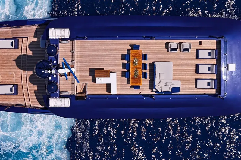 Blade II Yacht Photos Pics Aerial view of luxury yacht MMGI BLADE II, 2009, with elegant deck and ocean backdrop.