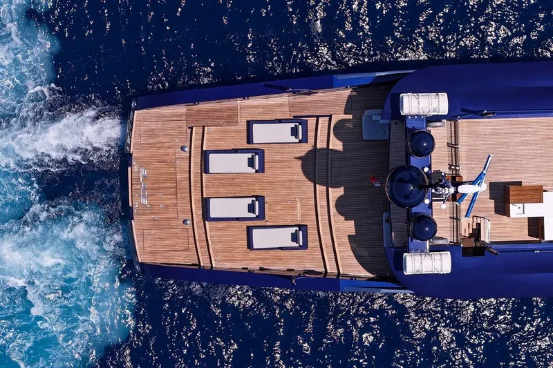 Blade II Yacht Photos Pics Aerial view of MMGI BLADE II yacht cruising on blue ocean waters, 2009 model.
