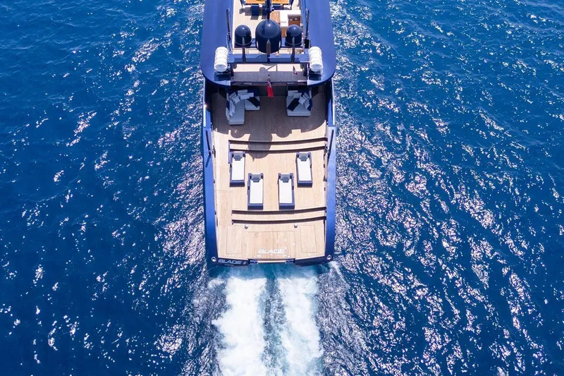 Blade II Yacht Photos Pics Aerial view of MMGI BLADE II yacht cruising on blue ocean waters, 2009 model.